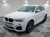 BMW X4 M Sport Line blanche sur un sol à damier
