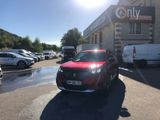 a red car that is parked in front of a building