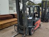 a forklift that is parked in front of a building