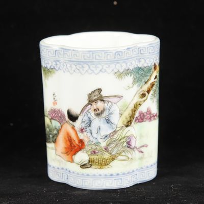 a cup that has a picture of a man and a cat on it