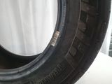 a close up of a tire on a white surface