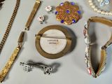 many different types of jewelry on the table