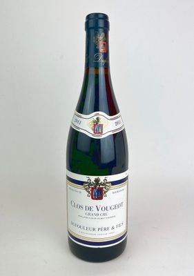 a bottle of wine that is sitting on a table