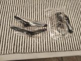 two pairs of glasses and a pair of hair clips on a table