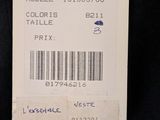 a label on the back of a black shirt