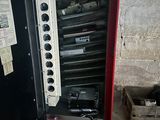 a red cabinet with a bunch of electronic equipment inside of it
