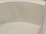 a toilet with a seat and a toilet paper dispenser on it