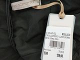 the back of a black jacket with a tag on it