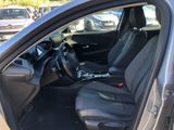 the interior of a car with the driver ' s seat folded down