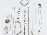 an assortment of silver jewelry including rings, bracelets, rings, and other items