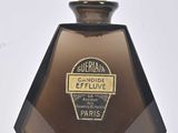 an image of a bottle of perfume sitting on top of a white surface