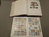 a open book with stamps on it sitting on a table