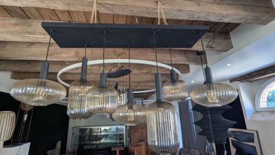 a chandelier that has a lot of lights hanging from it