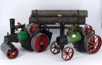 a small model of a steam engine with a log on it