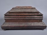 an old wooden box sitting on top of a table