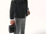 a figurine of a man in a suit and tie