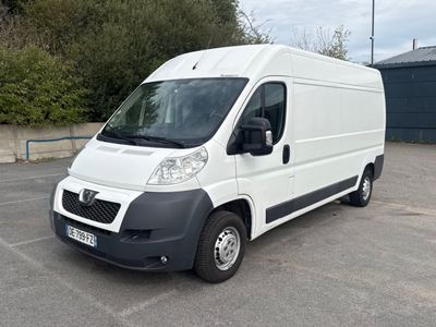 a white van that is parked in a parking lot