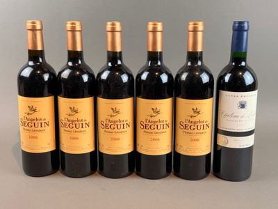 six bottles of wine lined up in a row on a table