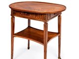 une table ovale dotée d'une étagère sur le dessus et d'un tiroir en dessous
