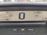 a car dashboard with a digital display on it ' s dashboard