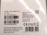the back of a white phone with a barcode on it