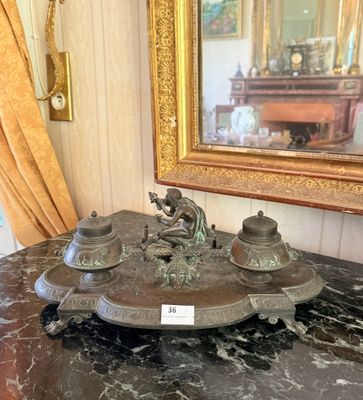 a marble table with a clock on it and a mirror in the background