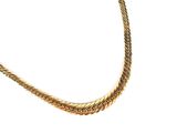 a gold necklace with a chain on a white background