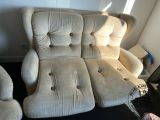 a reclining chair and two recliners in a room