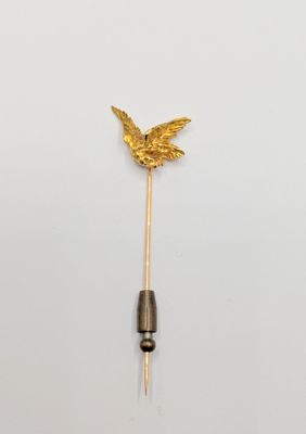 an image of a gold butterfly lapel pin on a white background