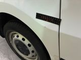 a close up of a white truck with a sticker on it