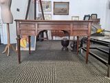 an image of a desk in a room with a mannequin on it