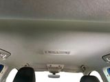 the interior of a car with the sunroof down and the passenger seat down