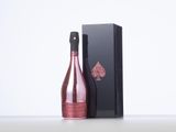 an image of a bottle of champagne next to a black box