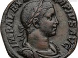 an ancient coin with a man wearing a headband on top of it