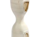 a white vase with a hole in the middle of it
