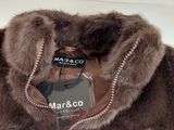 a brown fur jacket with a zipper on it