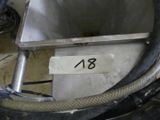 a picture of a stainless steel tank with a hose attached to it
