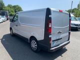a white van that is parked in a parking lot