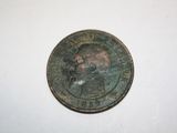 a close up of a coin on a table with a white background