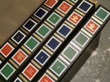 three boxes with stamps on them sitting on a table