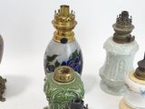 many different vases that are sitting on a white surface