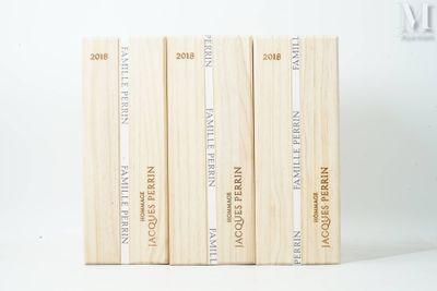 three books are stacked on top of each other on a white surface