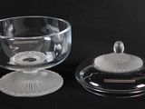 a glass bowl with a lid and a glass bowl with a lid
