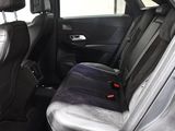 the back seat of a car with a seat belt in it