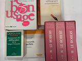 a box of books on a table with other books on it