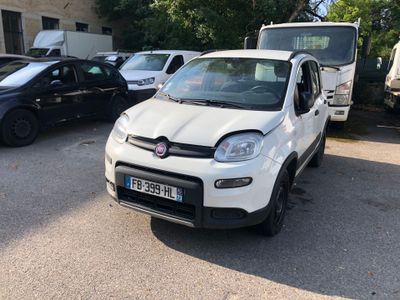 a small white car that is parked in a parking lot
