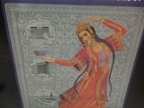 a sign with a picture of a woman in a red dress on it
