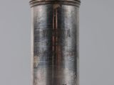 a close up of a silver object on a table