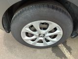 a close up of a car ' s tire on the street
