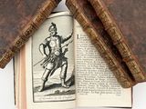 two old books that are sitting on top of each other